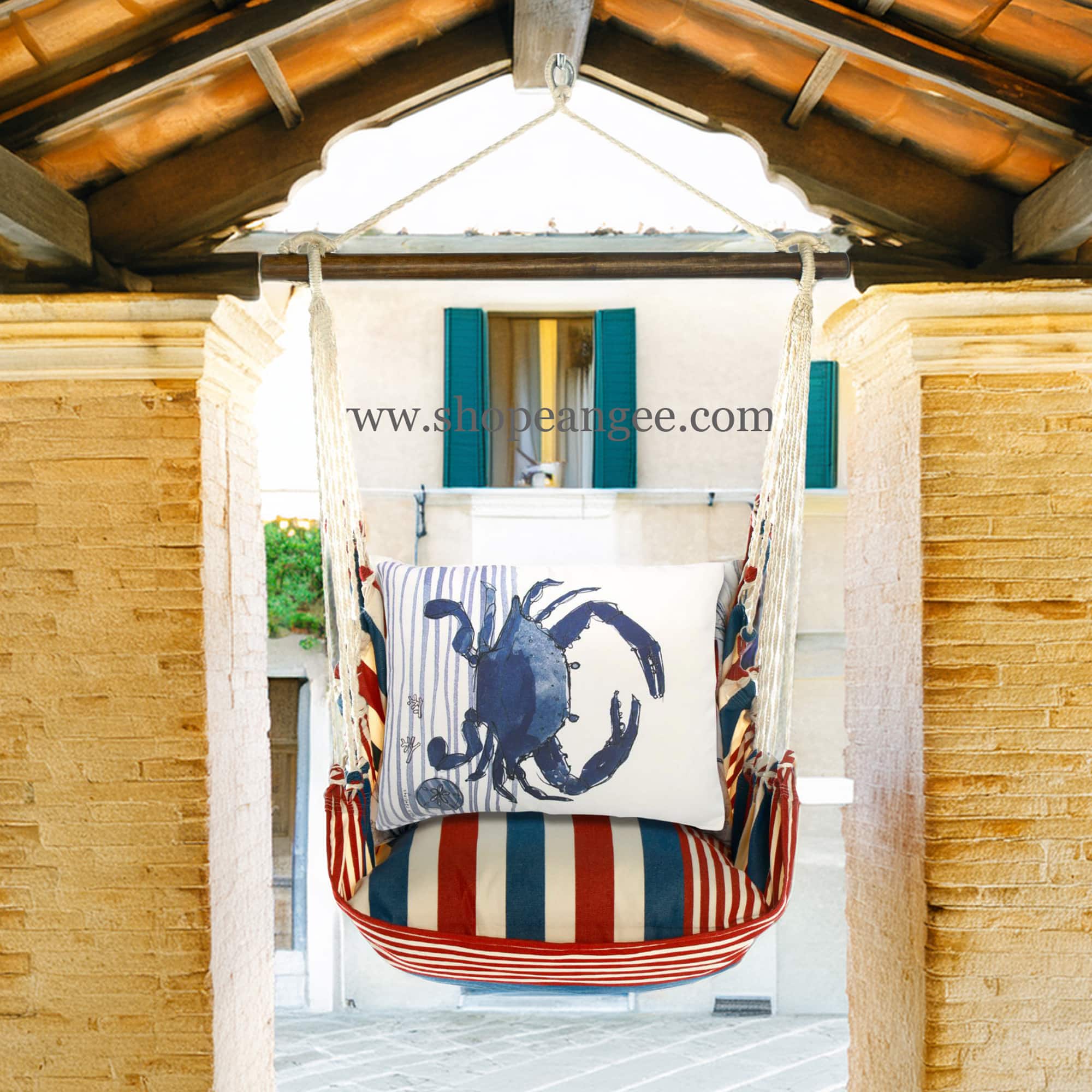 In a poolside chaise a multi colored outdoor swing crafted by the artisans of Magnolia Casual called the Swing Set 4 piece Stars & Stripes w/ Crab is displayed featuring 100 percent weather resistant fabric, weather resistant polyester fabric, handcrafted adding comfort and style to the space featuring with a stripes motif.