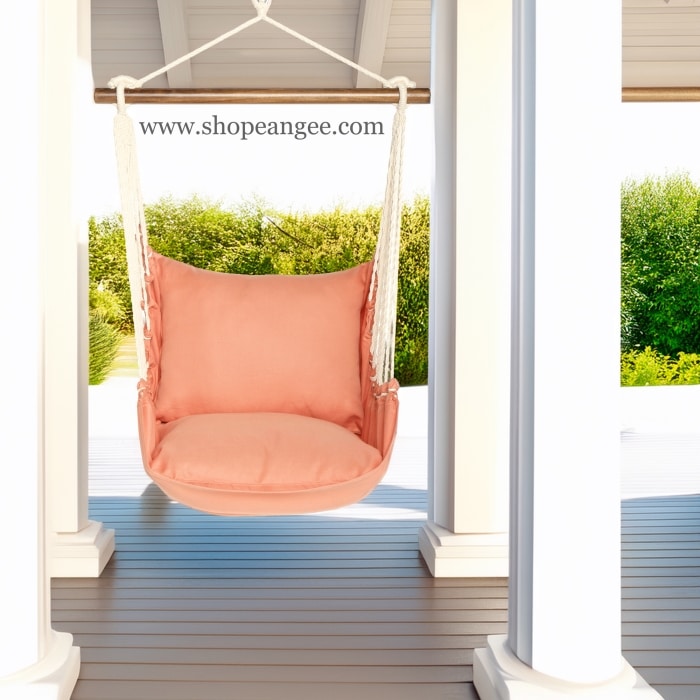 In a coastal inspired deck chair a multi colored outdoor swing crafted by the artisans of Magnolia Casual called the Swing Set 4 piece Living Coral w/ Living Coral is displayed featuring 100 percent weather resistant fabric, weather resistant polyester fabric, handcrafted adding comfort and style to the space featuring with a coral motif and shades of coral.