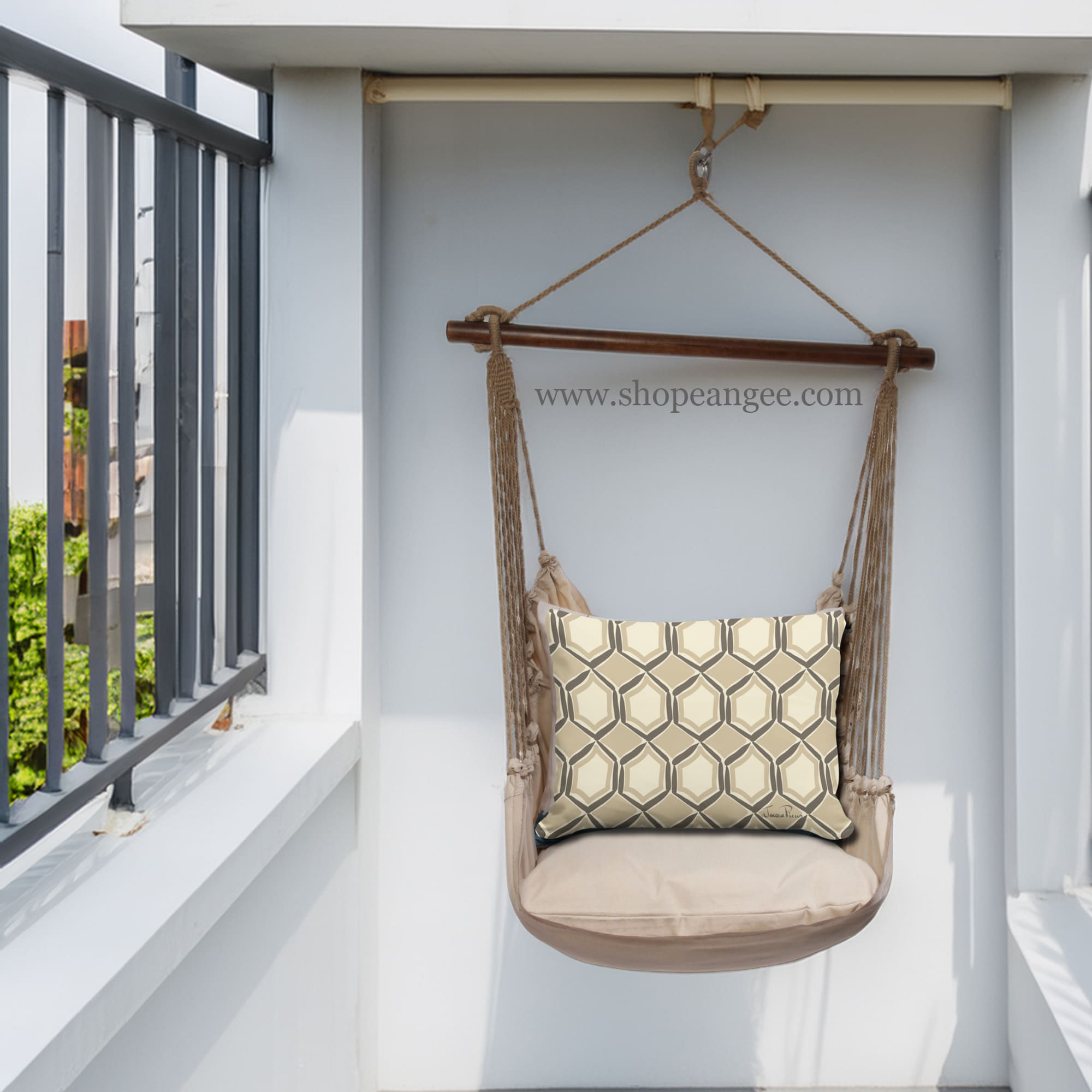 In a cozy garden seating area a multi colored outdoor swing crafted by the artisans of Magnolia Casual called the Swing Set 4 piece Latte Solid w/ Vintage Mirrors is displayed featuring 100 percent weather resistant fabric, weather resistant polyester fabric, handcrafted adding comfort and style to the space.