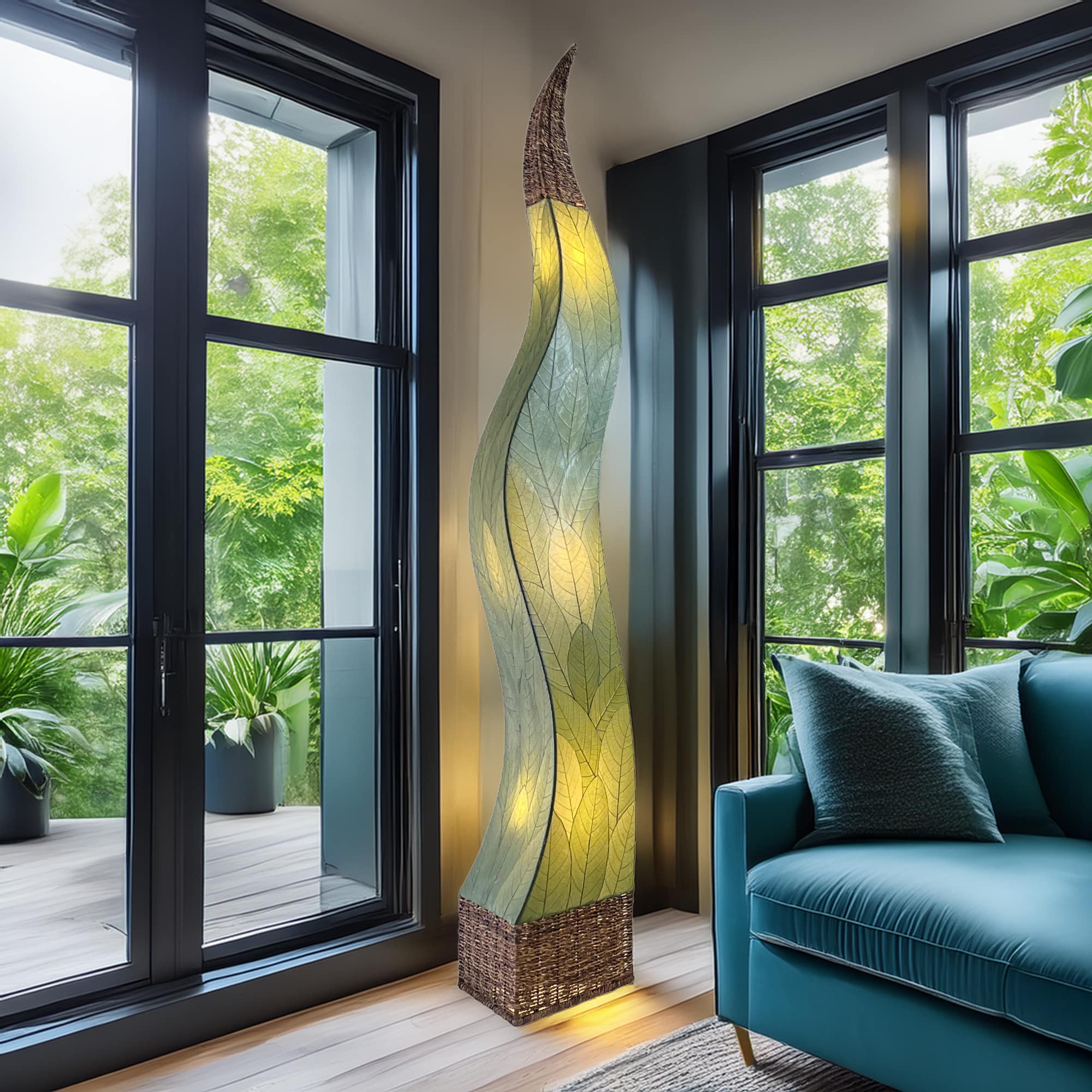 In a studio setting, the Flame Giant crafted by the artisans of Eangee Home Design Lamp in green finish by Eangee Home Design creates an inviting atmosphere with its fossilized cocoa leaf panels, abaca twine accents, and hand placed natural leaves.