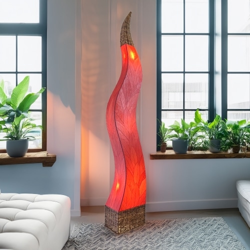 In a modern interior with earth tones, crafted by the artisans of Eangee Home Design, the Flame Giant Lamp in red stands gracefully, featuring fossilized cocoa leaf shade, abaca rope accents, fair trade, adding warmth and character to the space.
