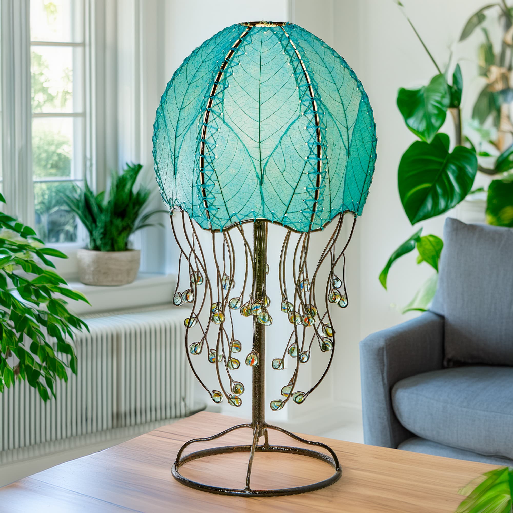 Crafted by the artisans of Eangee Home Design, the Leaf Nightlight in purple against a clean backdrop, featuring fossilized cocoa leaf shade, eco friendly, handcrafted.