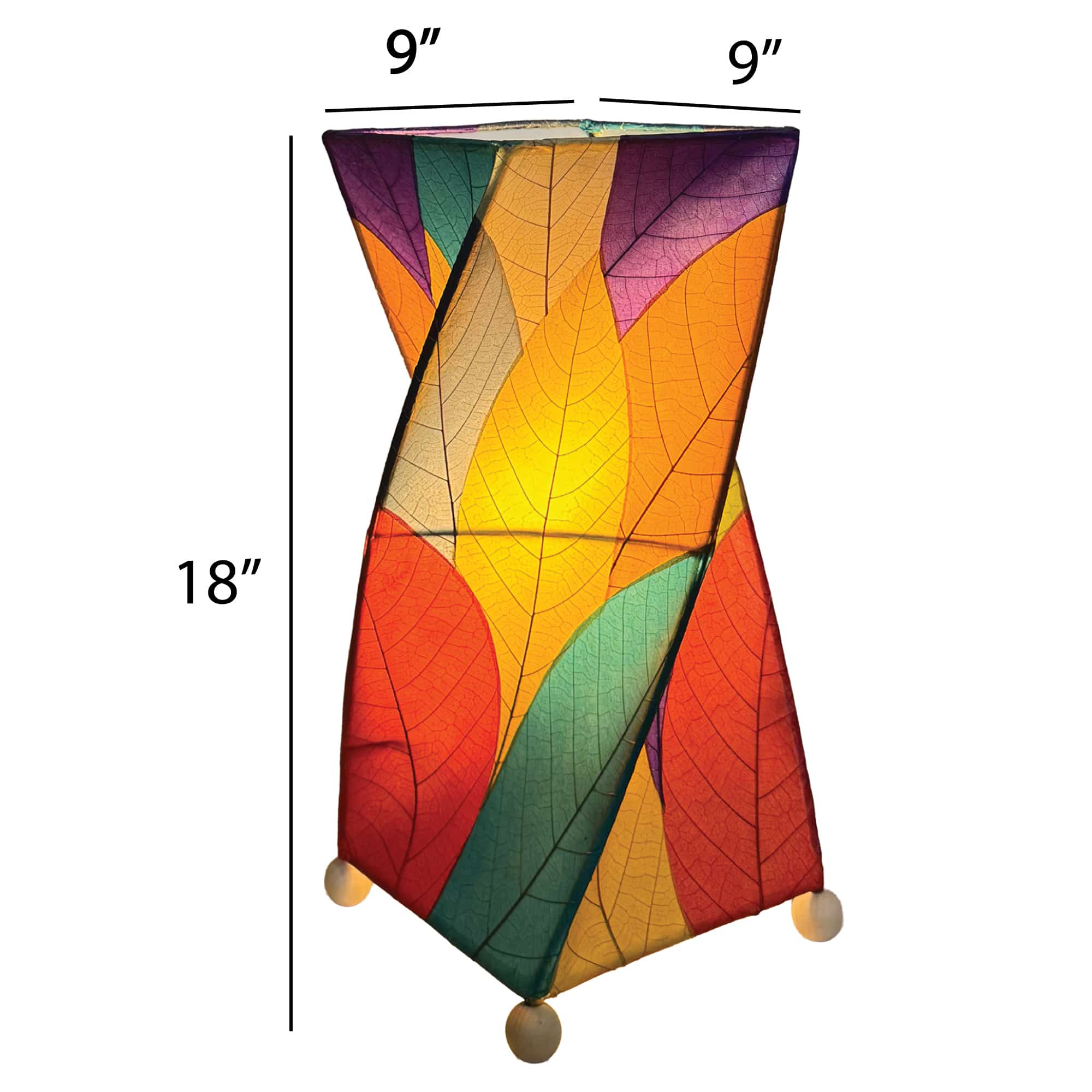 Crafted by the artisans of Eangee Home Design, the Twist Table Lamp in multi color against a clean backdrop, featuring fossilized cocoa leaf shade, wrought iron frame, handcrafted.