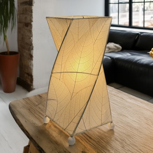Twisted cube table lamp crafted by Eangee Home Design clad in vertical natural fossilized cocoa leaves; 90?degree rotation adds dynamism while cozy light spills through every vein; sustainably handcrafted by skilled artisans