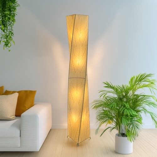 Crafted by the artisans of Eangee Home Design, the Twist Giant Floor Lamp in natural against a clean backdrop, featuring fossilized cocoa leaf shade, wrought iron frame.