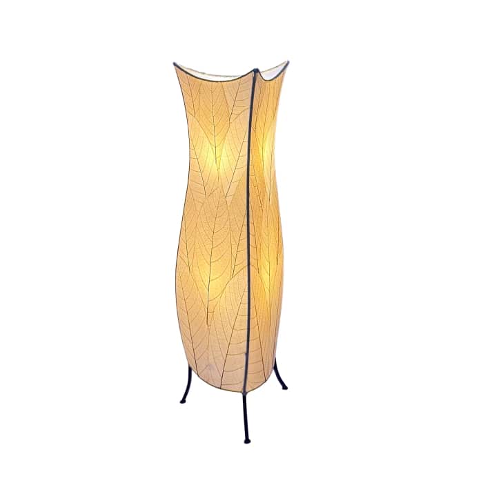 In a minimalist loft with natural textures, crafted by the artisans of Eangee Home Design, the Flowerbud Large Floor Lamp in natural stands gracefully, featuring fossilized cocoa leaf shade, adding warmth and character to the space.