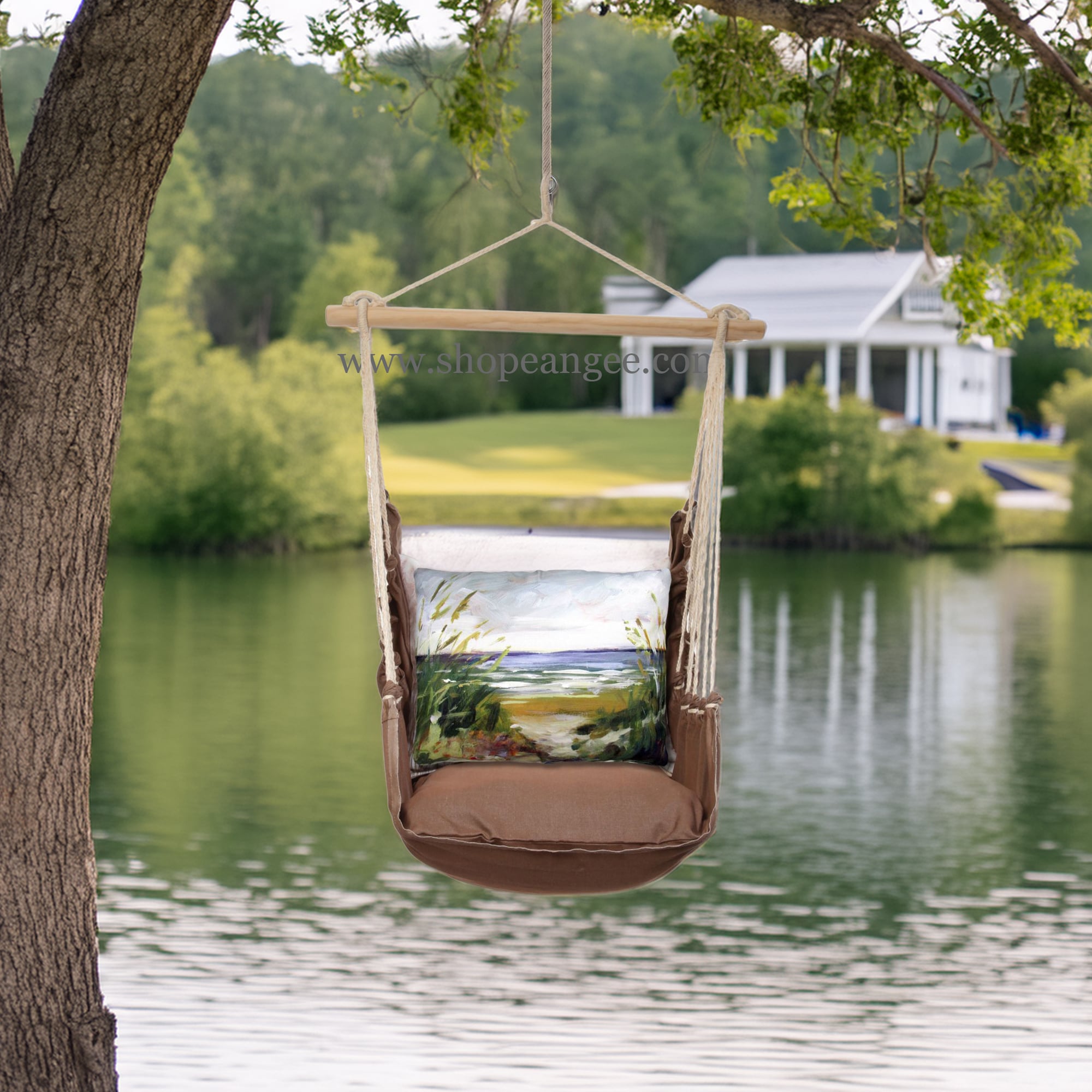 In an outdoor reading nook a multi colored outdoor swing crafted by the artisans of Magnolia Casual called the Swing Set 4 piece Chocolate Solid w/ Beach Path is displayed featuring 100 percent weather resistant fabric, weather resistant polyester fabric, artisan, natural materials adding comfort and style to the space.