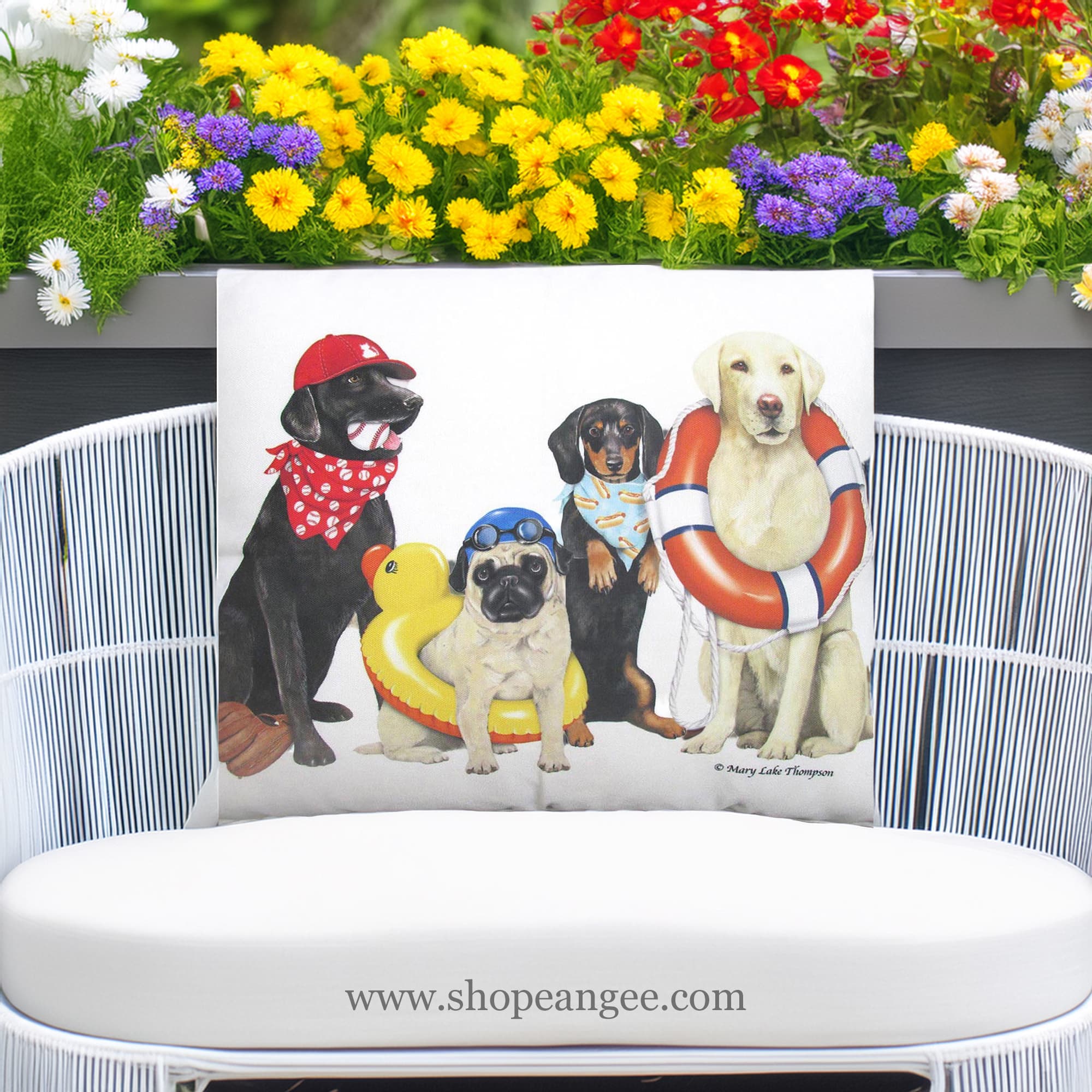 In a coastal inspired deck chair a multi colored outdoor pillow crafted by the artisans of Magnolia Casual called the Outdoor Pillow Dogs of Summer 19x24 is displayed featuring quality outdoor fabric adding comfort and style to the space.