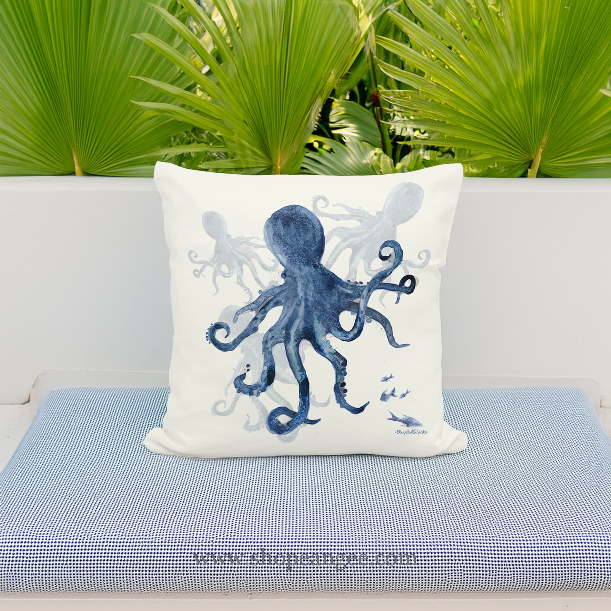 In a coastal inspired deck chair a multi colored outdoor pillow crafted by the artisans of Magnolia Casual called the Outdoor Pillow Indigo Octopus 18x18 is displayed featuring quality outdoor fabric adding comfort and style to the space featuring with a octopus motif.