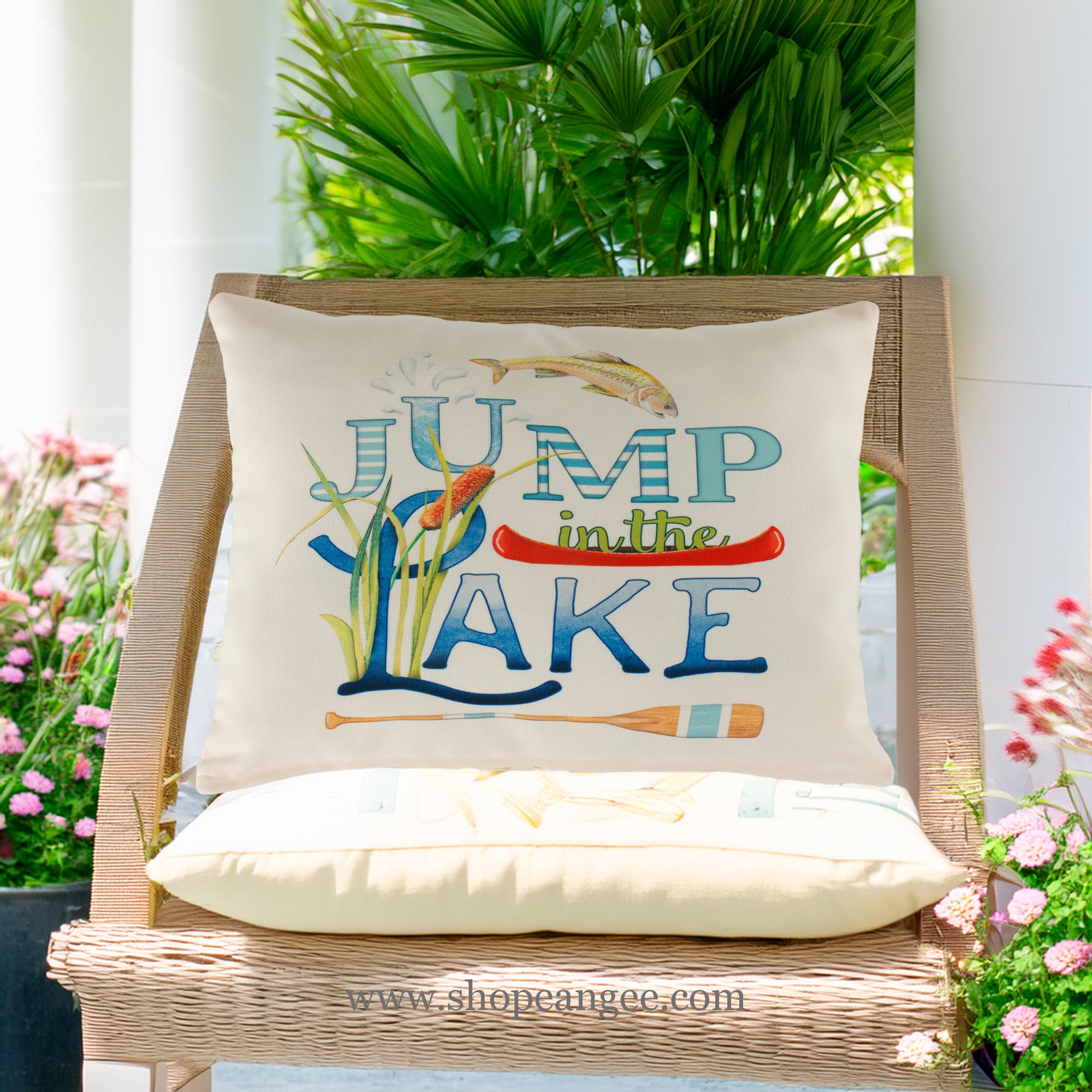 In a shaded porch swing a multi colored outdoor pillow crafted by the artisans of Magnolia Casual called the Outdoor Pillow Jump in Lake 13x18 is displayed featuring quality outdoor fabric adding comfort and style to the space.