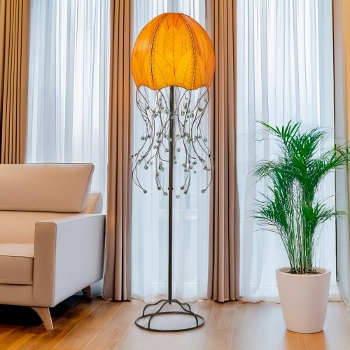 Orange Jellyfish Large Floor Lamp by Eangee Home Design - dome shade formed from fossilized cocoa leaves with iron tendril 'tentacles' dotted by glass beads; radiates a calming ambient light while lending artful biophilic texture.