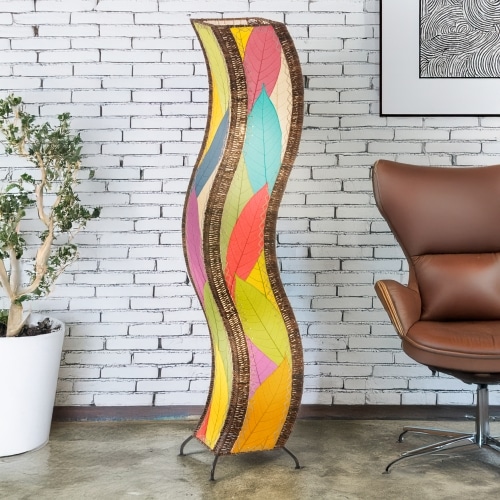 Multicolor Wave Large Floor Lamp by Eangee Home Design - curving sculptural column clad in overlapping fossilized cocoa leaf panels; handmade lamp casts vibrant leaf-textured light that energizes the space.