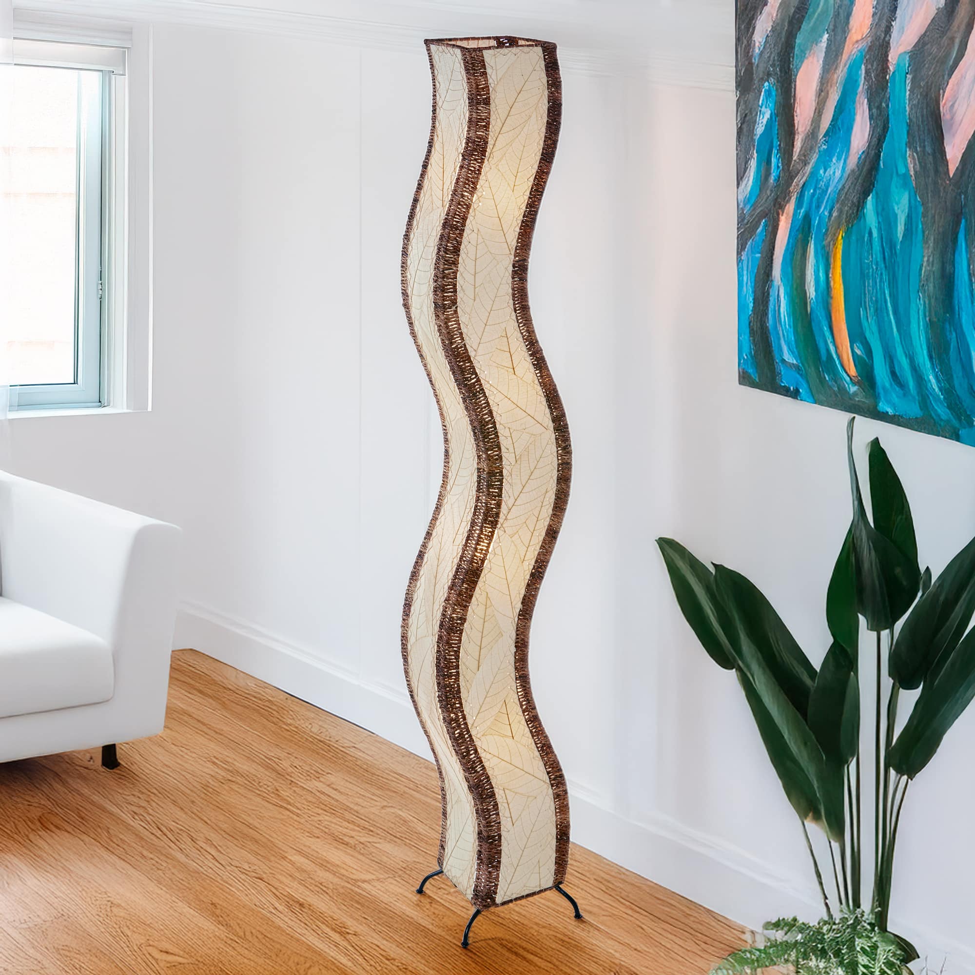 Natural Wave Giant Floor Lamp by Eangee Home Design - S shaped column in parchment tone fossilized leaves; gentle amber illumination brings earthy elegance to a bright sitting room.