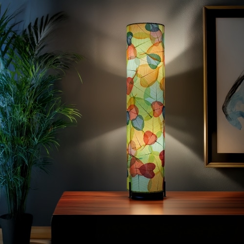 Multicolor Banyan Large Floor Lamp by Eangee Home Design - cylindrical floor lamp featuring layered fossilized cocoa leaves on a wrought-iron frame; hand-built design glows with cheerful leaf patterns, shaping daylight-filled interiors.