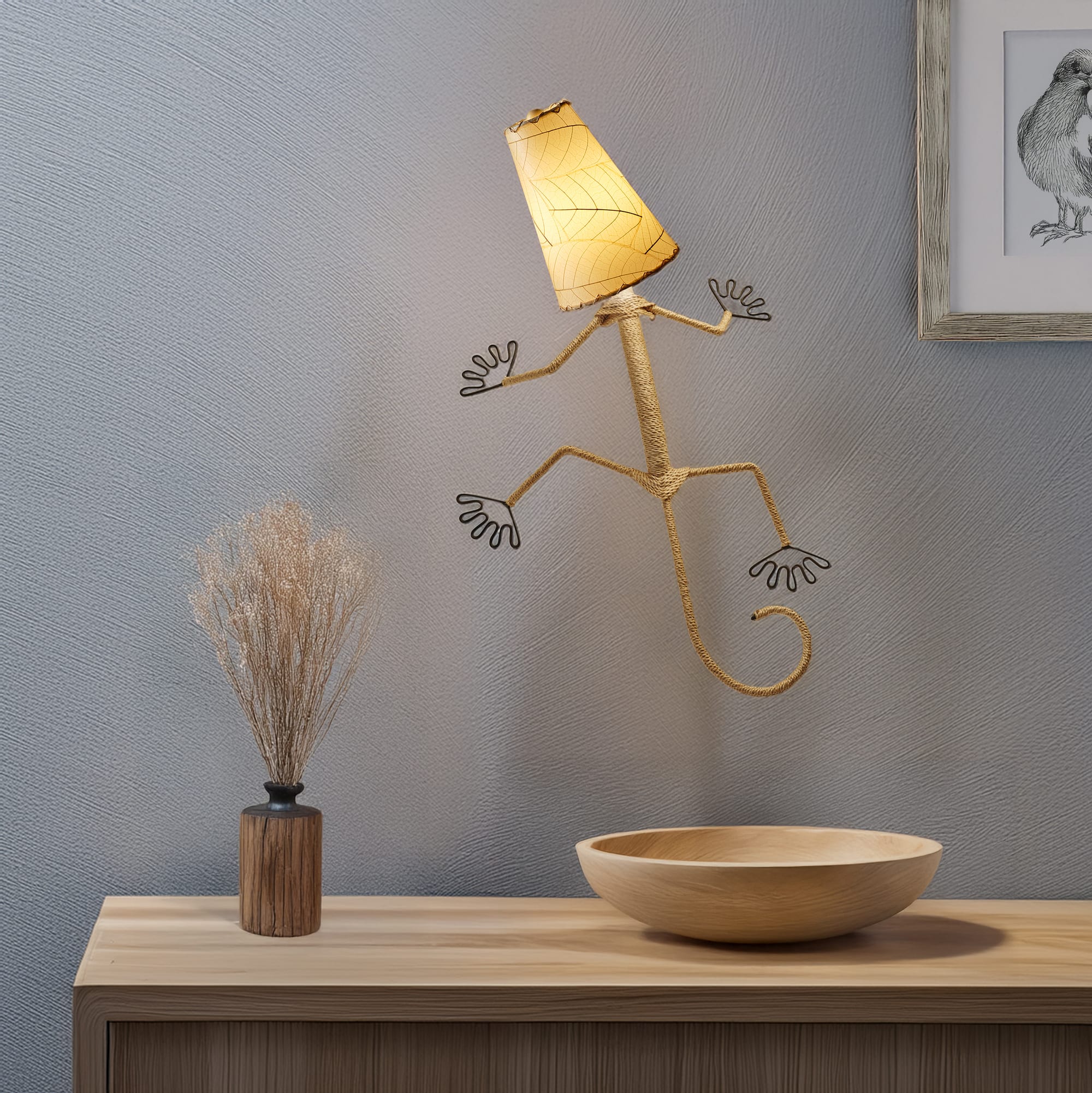 Eangee Home Design Gecko Wall Sconce in natural beige with a shade made of real cocoa leaves, whimsical lizard?shaped lamp climbing a neutral wall above modern decor