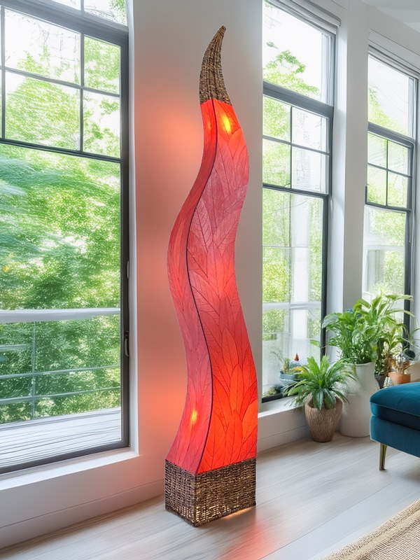 Colorful handmade floor lamp featuring vibrant leaf patterns, adding warmth to a stylish, cozy living room.