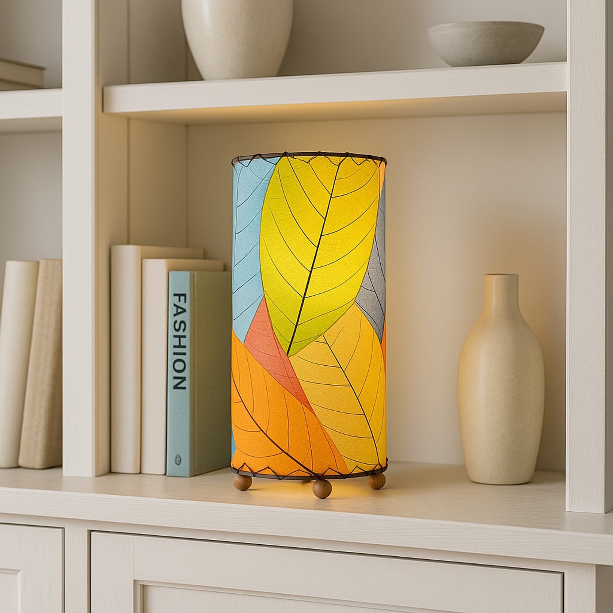 12 Inch Cocoa Leaf Cylinder Table Lamp Multi Color shade, handcrafted from real cocoa leaves . soft ambient light on an entry console beneath a round mirror with catchall dish.