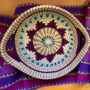 Biophilic design detail of a handmade woven basket showing natural texture, color variation, and artisan craftsmanship